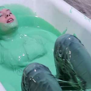 Stella: Stella bathes in a tub filled with 30 gallons of green gunge.