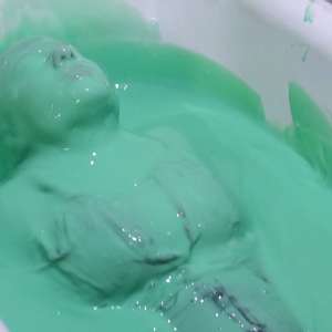 Stella: Stella bathes in a tub filled with 30 gallons of green gunge.