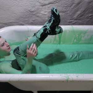 Stella: Stella bathes in a tub filled with 30 gallons of green gunge.