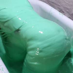 Stella: Stella bathes in a tub filled with 30 gallons of green gunge.