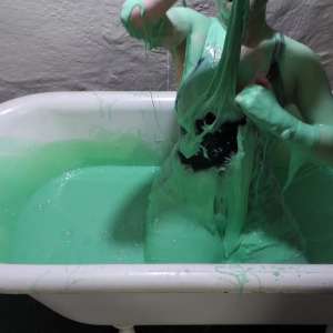 Stella: Stella bathes in a tub filled with 30 gallons of green gunge.