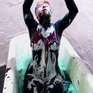 Stella: Stella paints her naked body in tub full of gunge.
