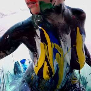 Stella: Stella paints her naked body in tub full of gunge.