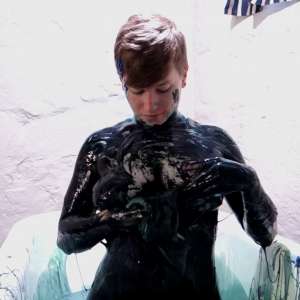 Stella: Stella paints her naked body in tub full of gunge.