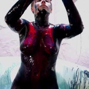 Stella: Stella paints her naked body in tub full of gunge.