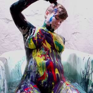 Stella: Stella paints her naked body in tub full of gunge.