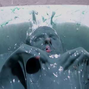 Stella: Stella paints her naked body in tub full of gunge.