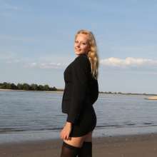 eileenvogel: Eileen swimming in a business suit at sunset