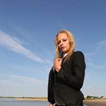 eileenvogel: Eileen swimming in a business suit at sunset