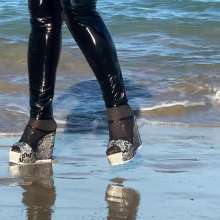 Wet_look_elena: Black Latex Pants and Red Top in the Sea