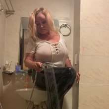 Wet_look_elena: Black Latex Pants in Shower