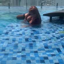 Wet_look_elena: Dress in Pool with Big Boots