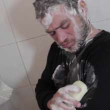 lovingmessy4you: Wetlook in the Shower Wearing Jacket, Sweater and Bluejeans