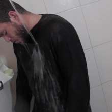 lovingmessy4you: Wetlook in the Shower Wearing Jacket, Sweater and Bluejeans