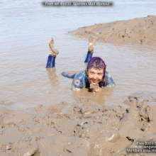 DungeonMasterOne: Spandex Mud Fun: Isabeau throws herself into the mud in a gorgeous catsuit
