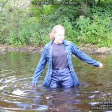 DungeonMasterOne: Purity wades into the river in jeans and a denim coat!