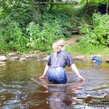 DungeonMasterOne: Purity wades into the river in jeans and a denim coat!