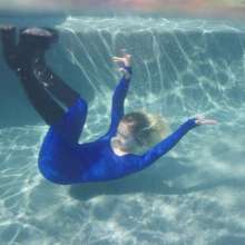 WetlookFashion: Jessica Takes a Dip Wearing a Jumpsuit, Boots and a Vest