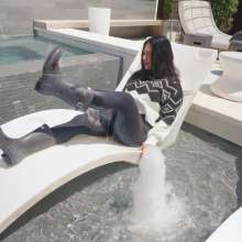WetlookFashion: Maria in the Pool Wearing Leggings, Sweater and Boots