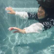 WetlookFashion: Maria in the Pool Wearing Leggings, Sweater and Boots