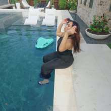 WetlookFashion: Tina Takes a Dip in the Pool Wearing a Shiny Jumpsuit