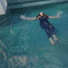 WetlookFashion: Tina Takes a Dip in the Pool Wearing a Shiny Jumpsuit