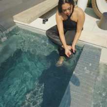 WetlookFashion: Tina Takes a Dip in the Pool Wearing a Shiny Jumpsuit